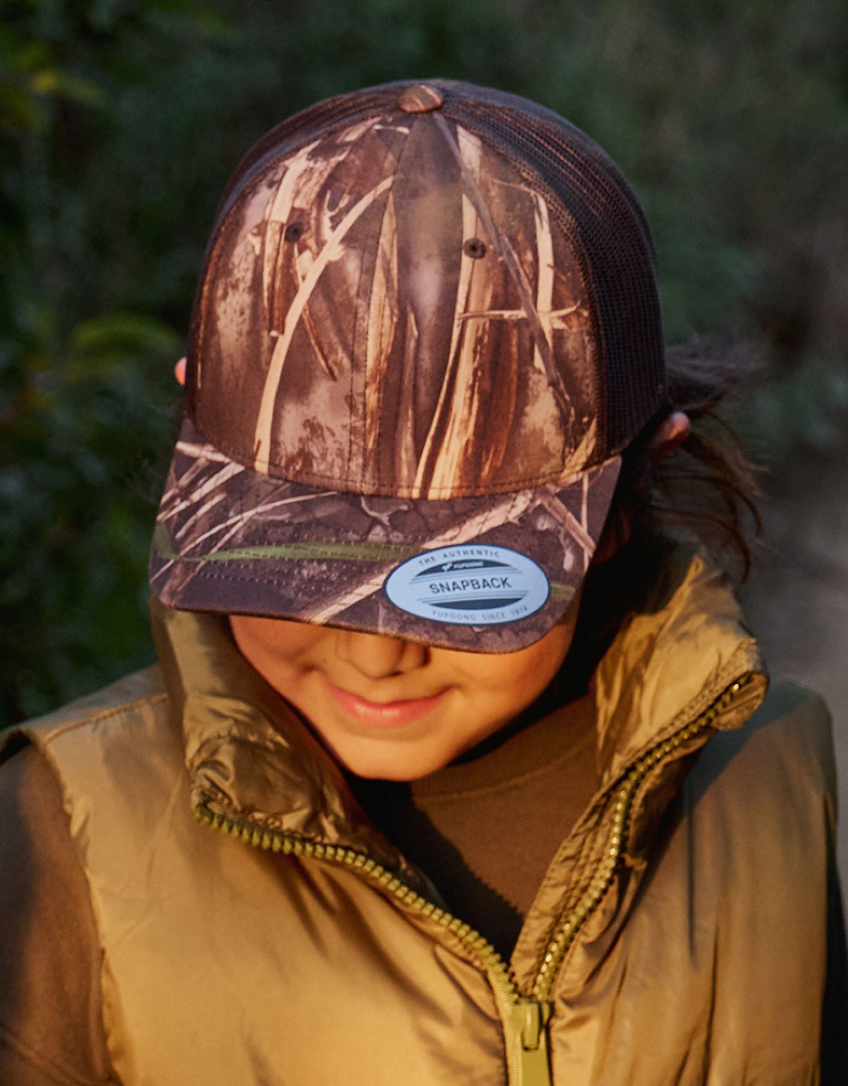 A woman wearing a REALTREE MAX-7® hat
